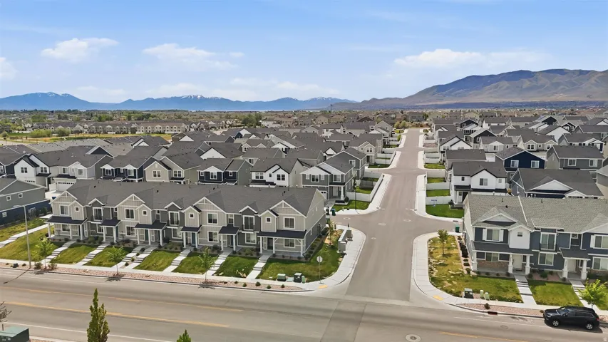 Expansive residential community featuring a variety of architectural styles, paved streets, and landscaped front yards