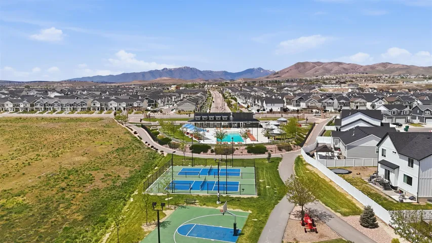 Community amenities featuring pickleball courts, a basketball court, and a swimming pool area