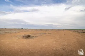 Expansive land offering a vast, open terrain with a natural, arid landscape