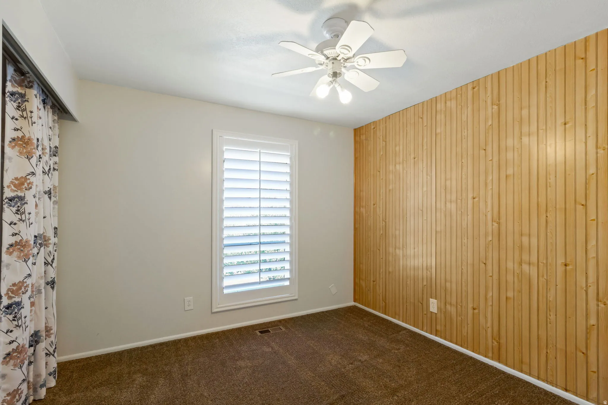 Accent wall with vertical wood paneling