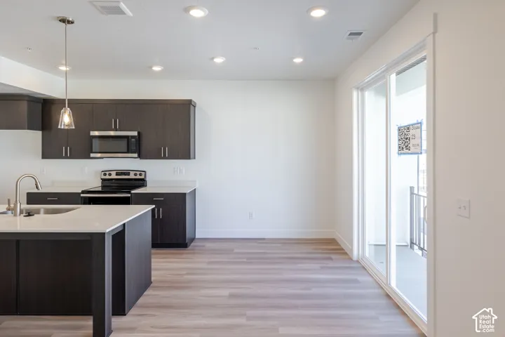 Kitchen island with an undermount sink and gooseneck faucet