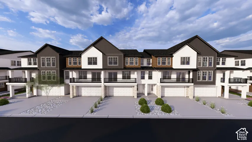 Contemporary townhome exteriors featuring multi-toned siding, black frame windows, and private balconies with black railings