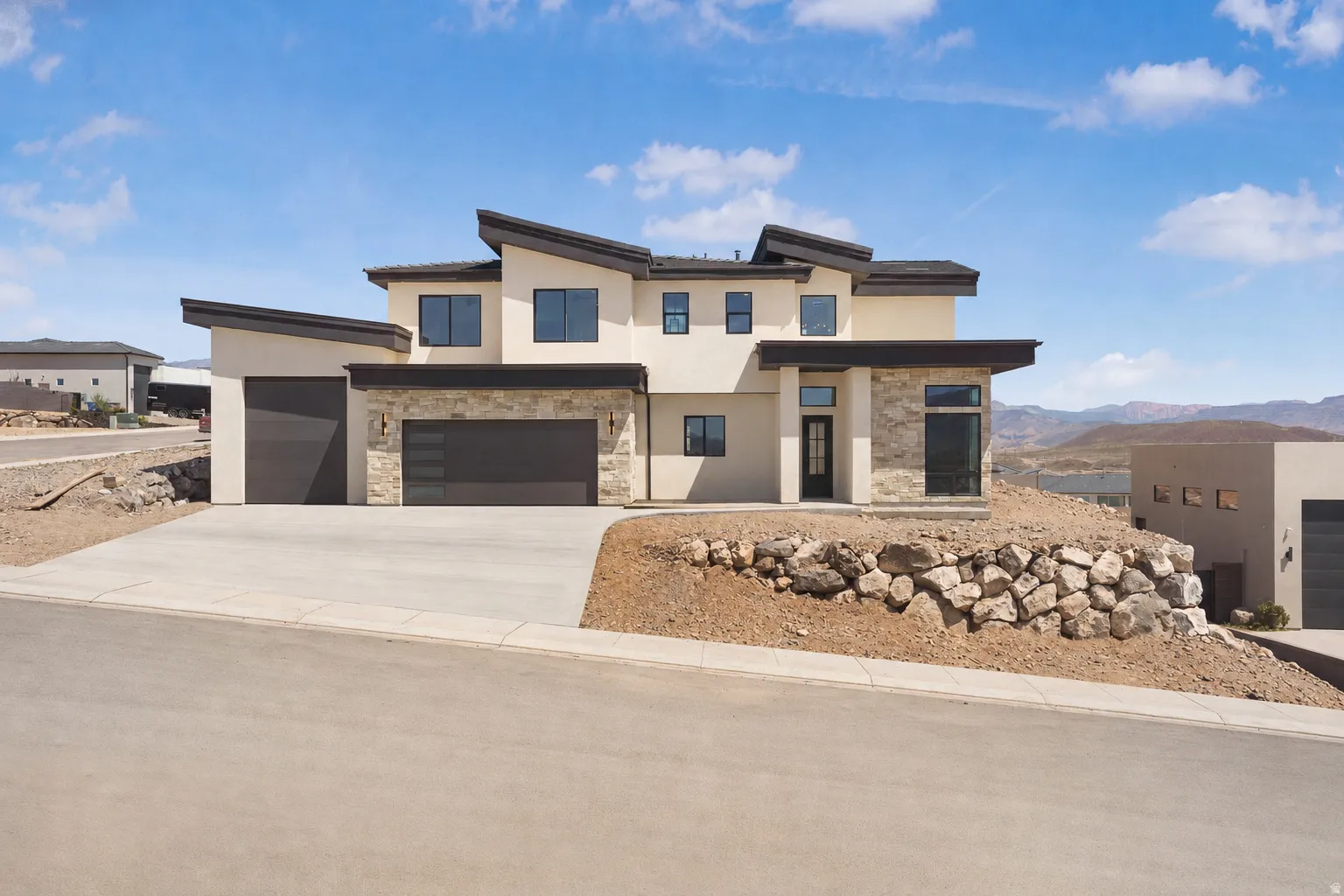 Contemporary exterior featuring stucco and stone accents