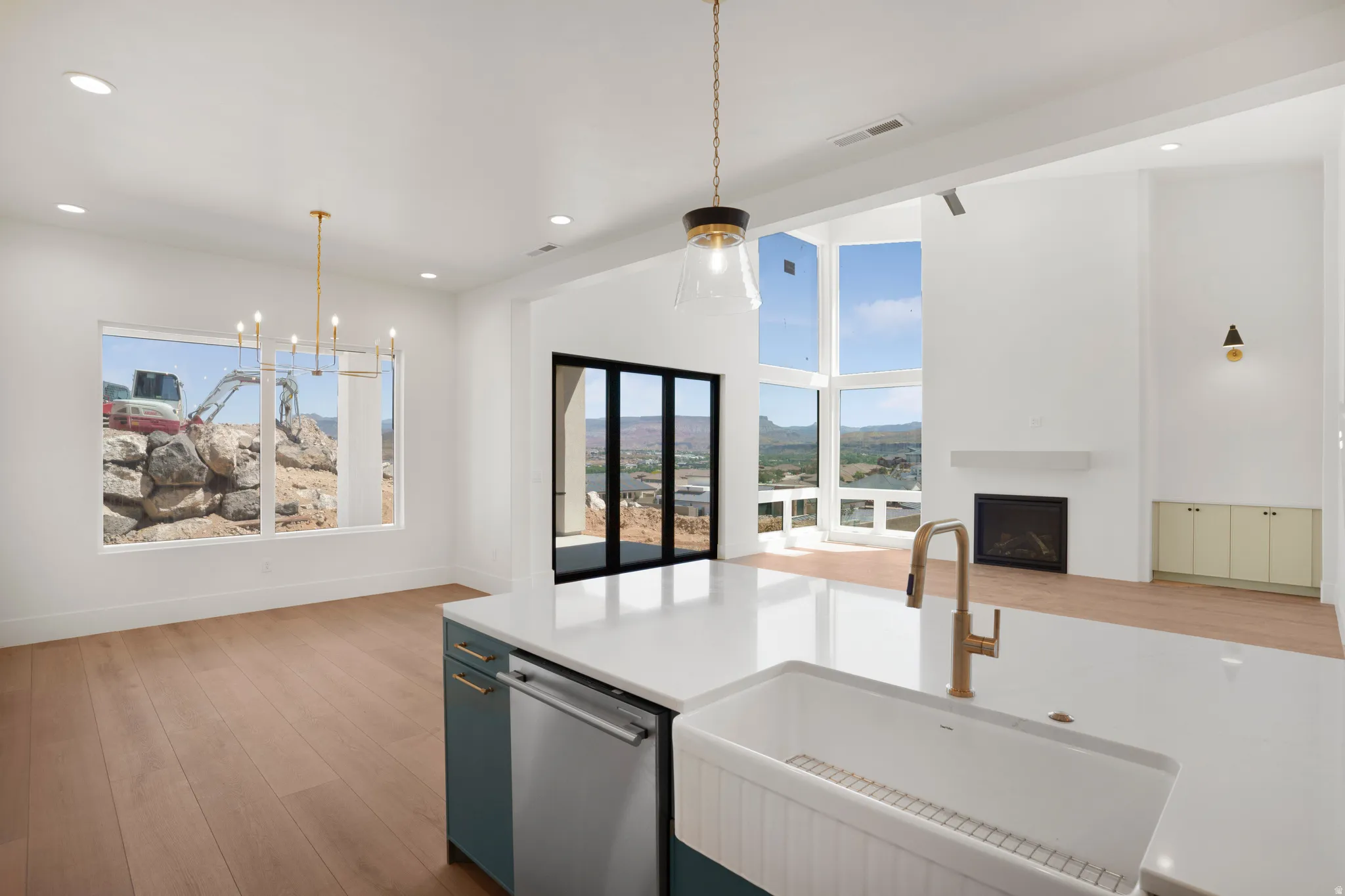 Contemporary kitchen island featuring a farmhouse sink, stainless steel dishwasher, and quartz countertop