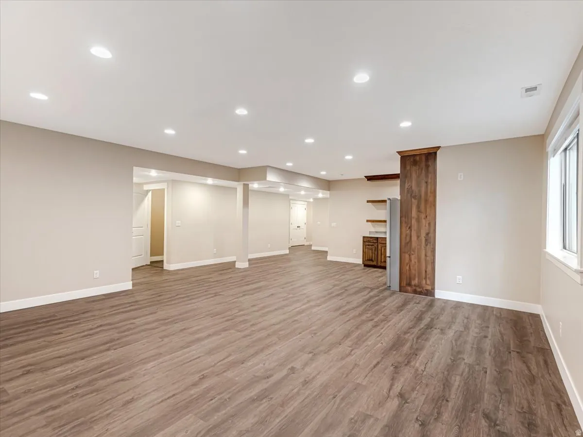 Spacious interior featuring wood-finish flooring throughout