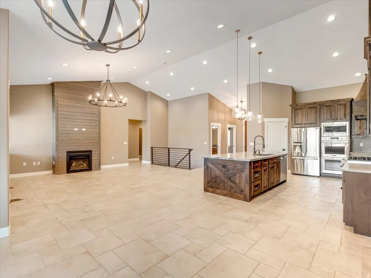 Expansive great room featuring vaulted ceilings and recessed lighting