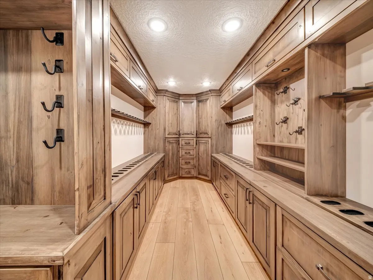 Custom wood-finish cabinetry throughout this dedicated storage space