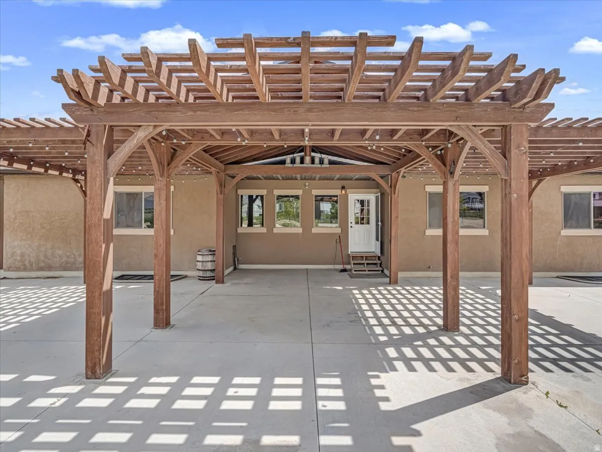Expansive wood pergola providing shaded outdoor living space