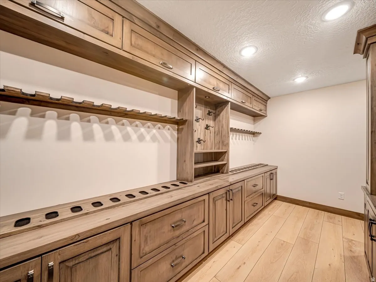 Custom wood-finish cabinetry with integrated storage