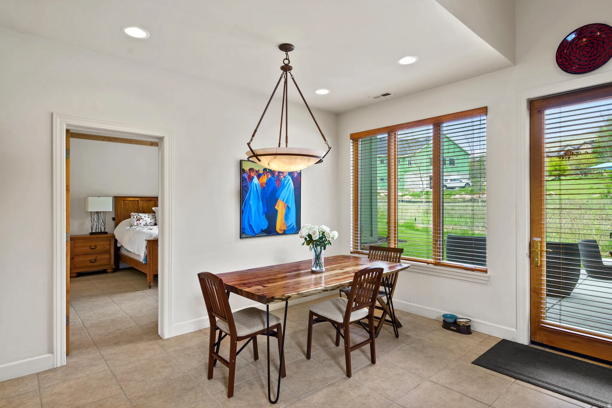 Dining area featuring recessed lighting and a decorative chandelier