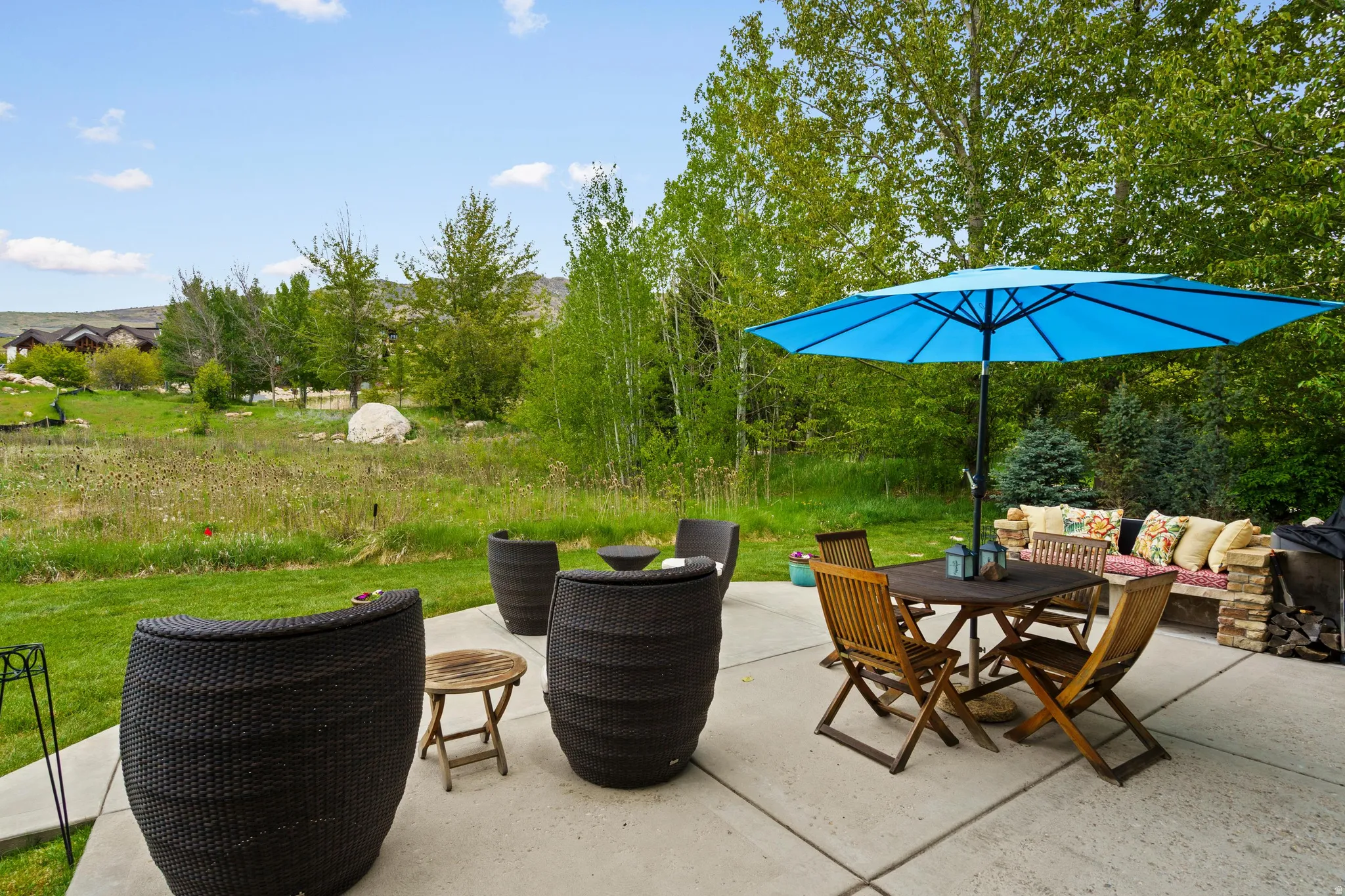 Expansive concrete patio offering open-air entertaining space