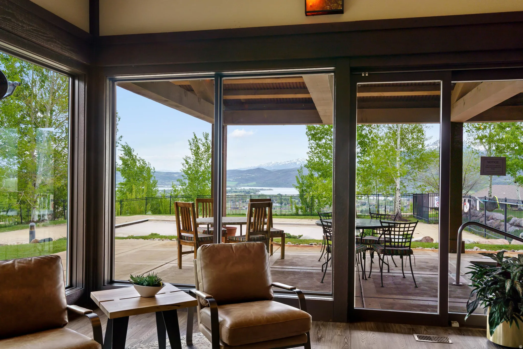 Expansive window wall with dark framing, offering scenic outdoor perspectives