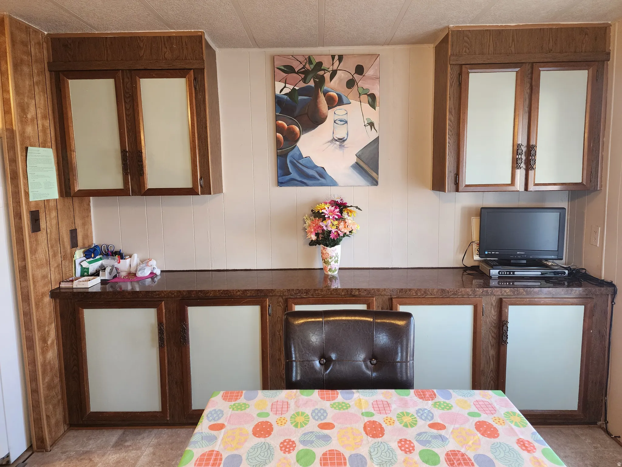 Built-in cabinetry featuring wood-finish framing and frosted glass inserts