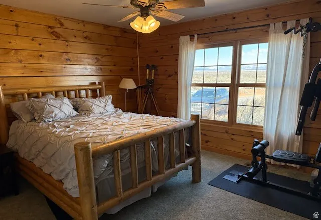 Wood-paneled room featuring a double-paned window with horizontal muntins