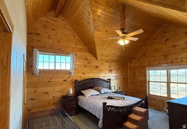 Vaulted ceilings featuring wood paneling throughout