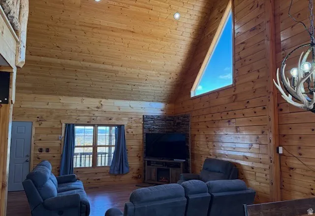 Vaulted wood-paneled ceilings with recessed lighting