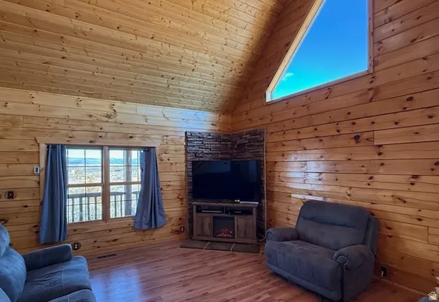 Vaulted wood-paneled ceiling with an angular upper window