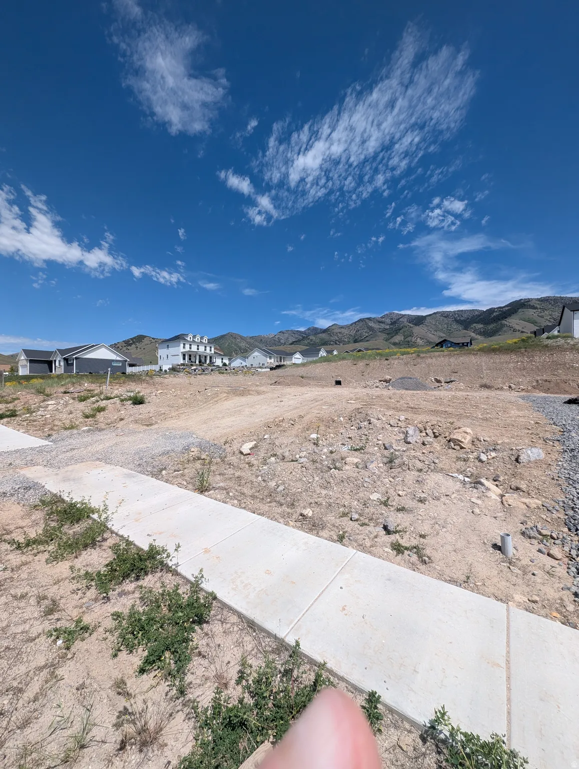 Expansive undeveloped lot with mountains as a backdrop