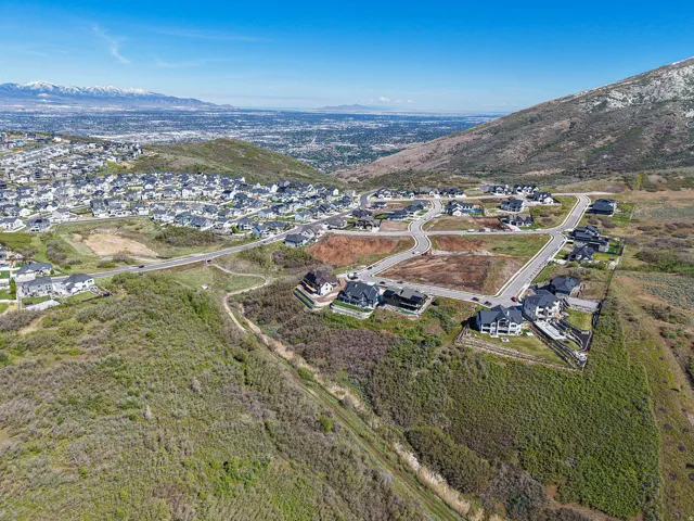 Expansive residential development featuring paved roads and several completed homes