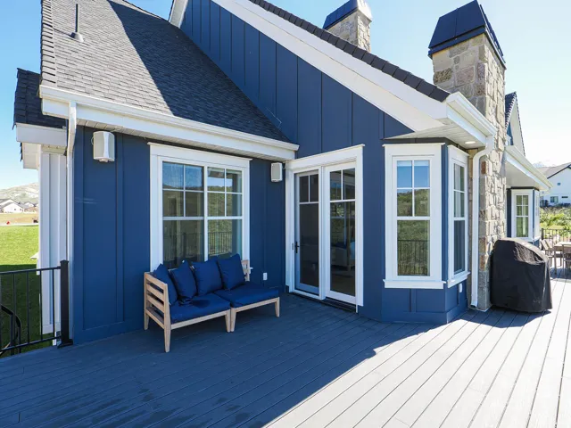 Expansive rear deck featuring composite decking and direct exterior access