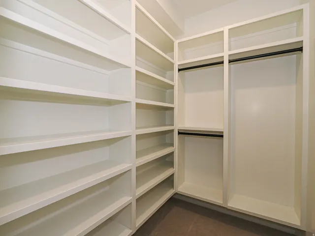 Built-in custom shelving system in a neutral finish