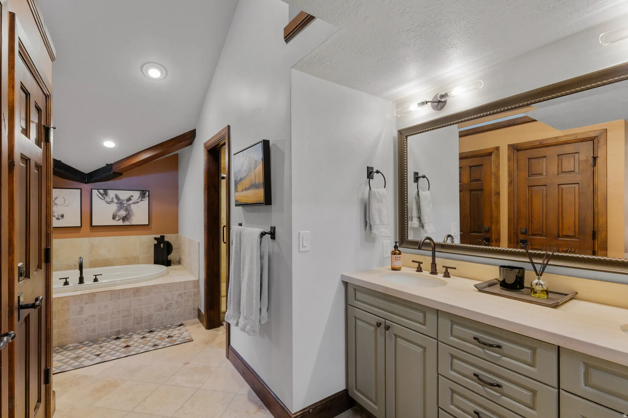 Dual vanity with integrated sinks and a stone-finish countertop