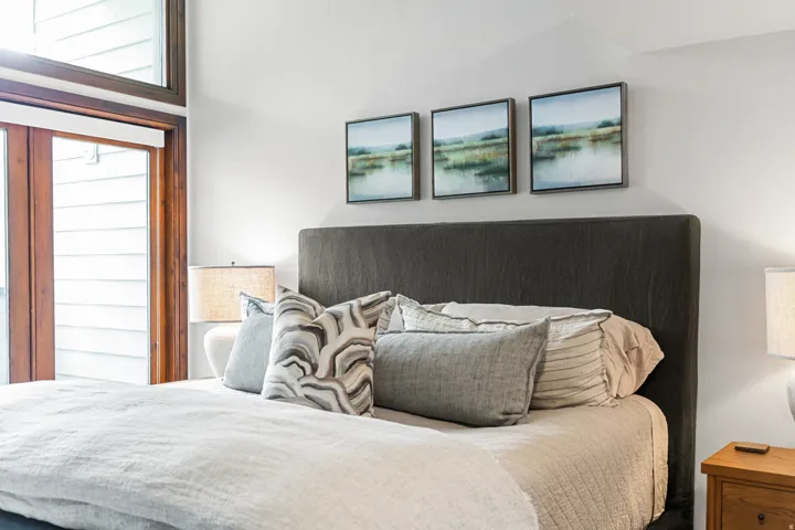 High ceilings featuring natural wood-frame doors and windows