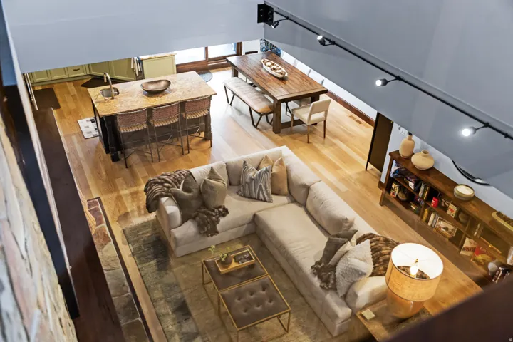 Open-concept living space featuring wood-finish flooring throughout