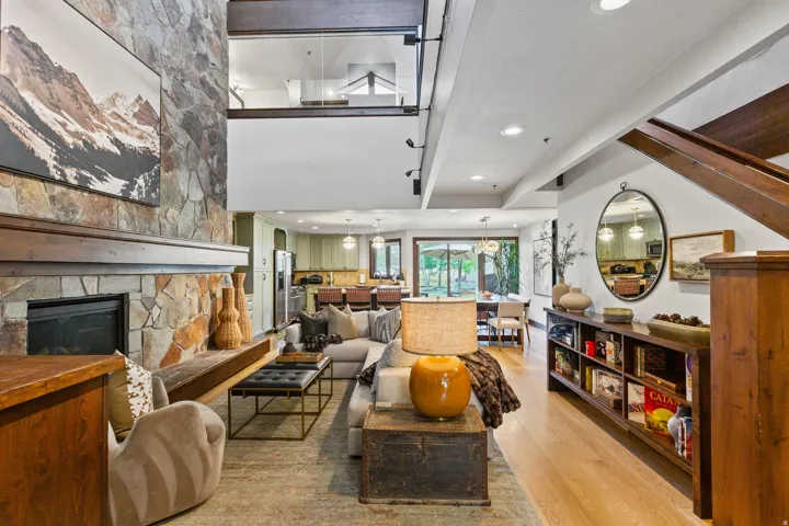 Stone-clad fireplace with a substantial wood mantel