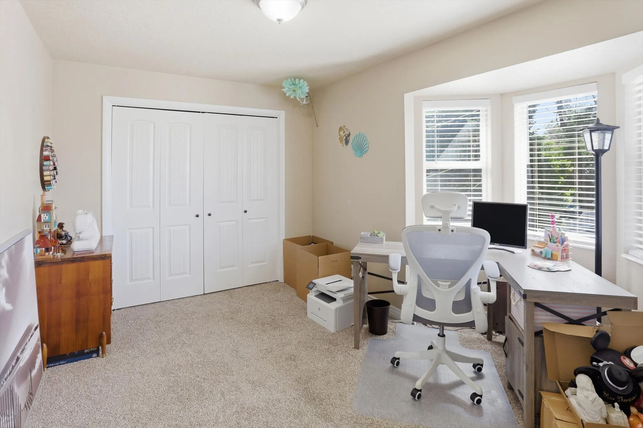 Bay window with white blinds and a neutral color palette