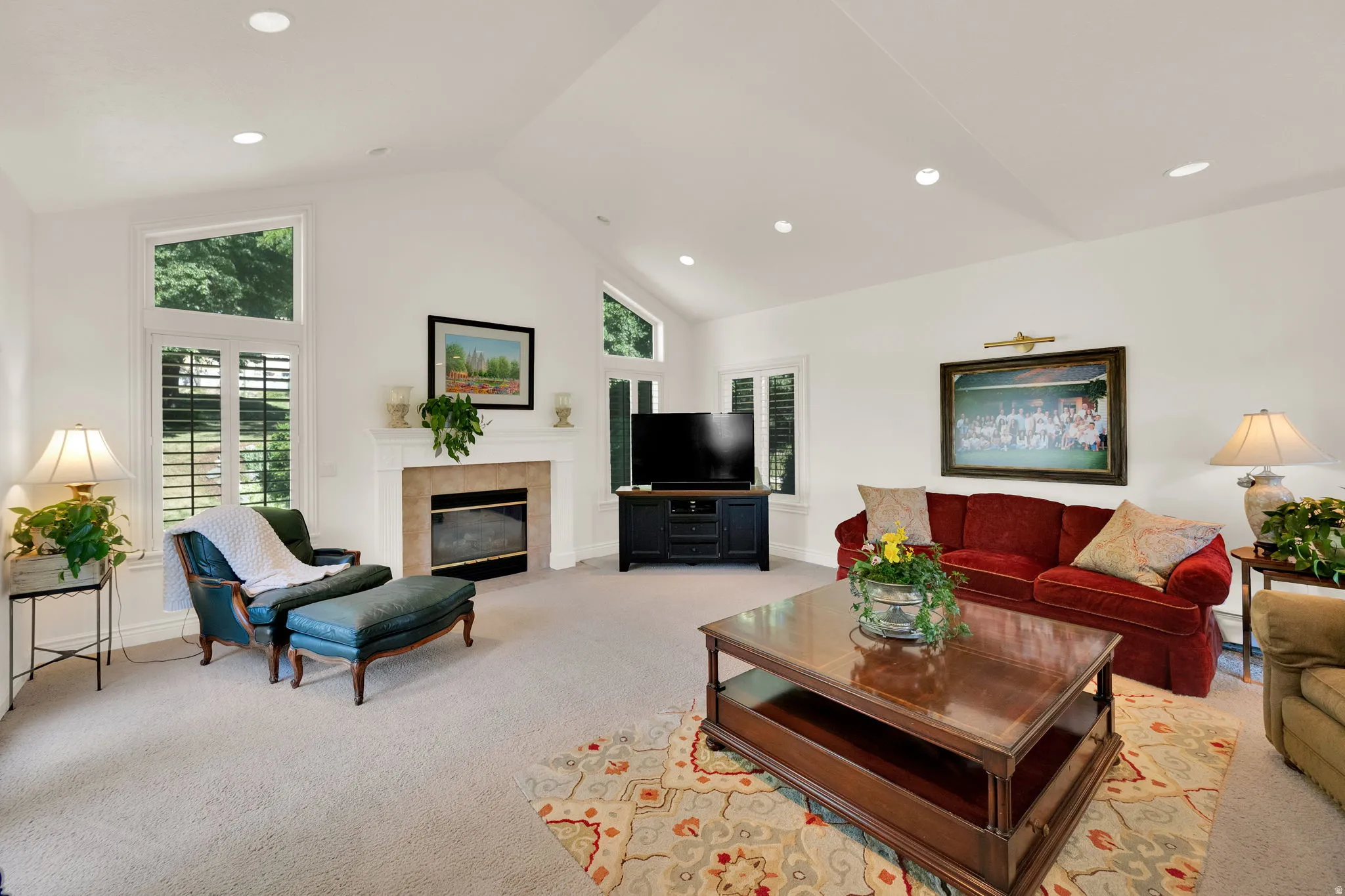 Family room featuring a vaulted ceiling and gas fireplace