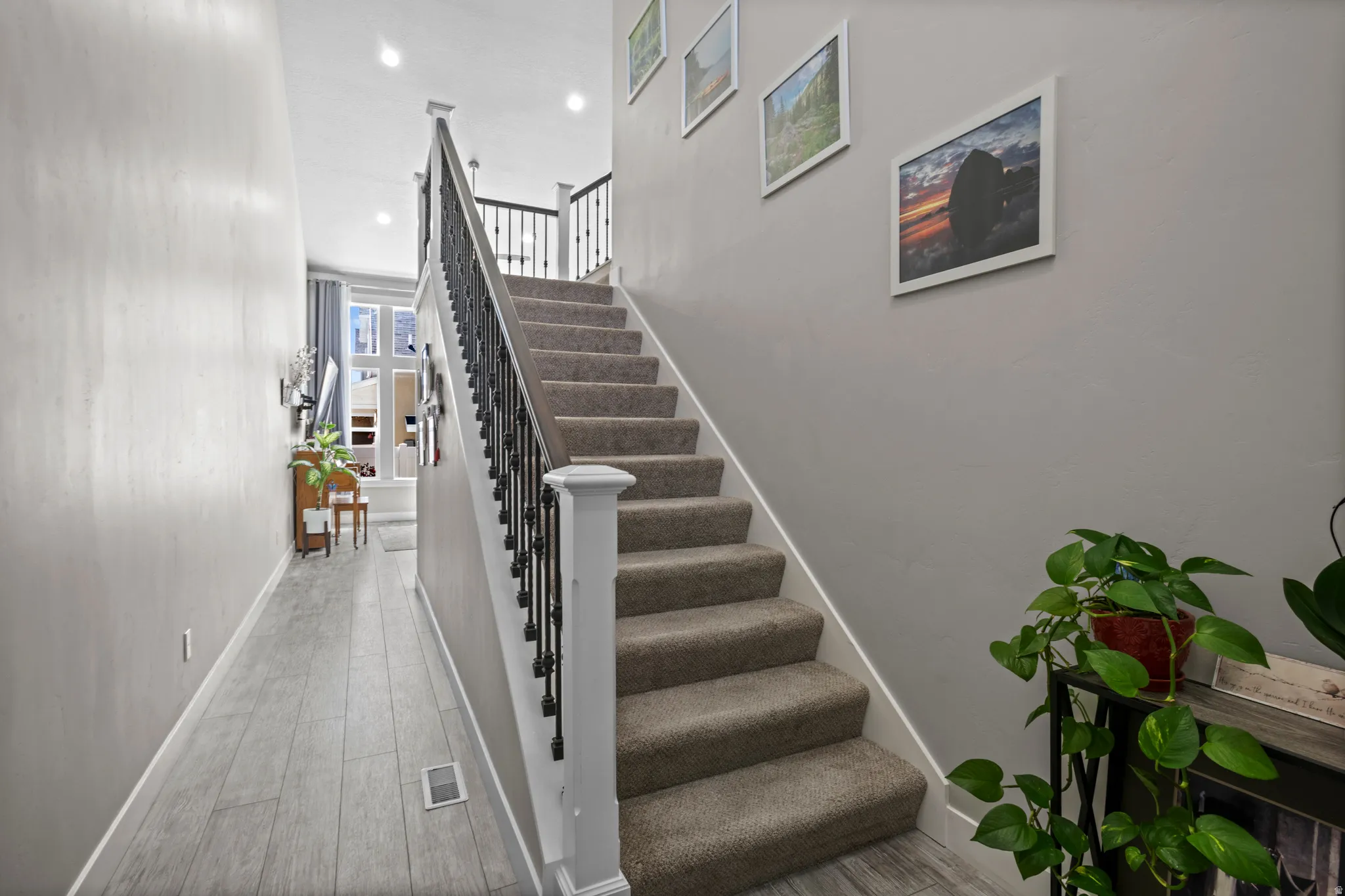Entryway with upgraded open stair rail
