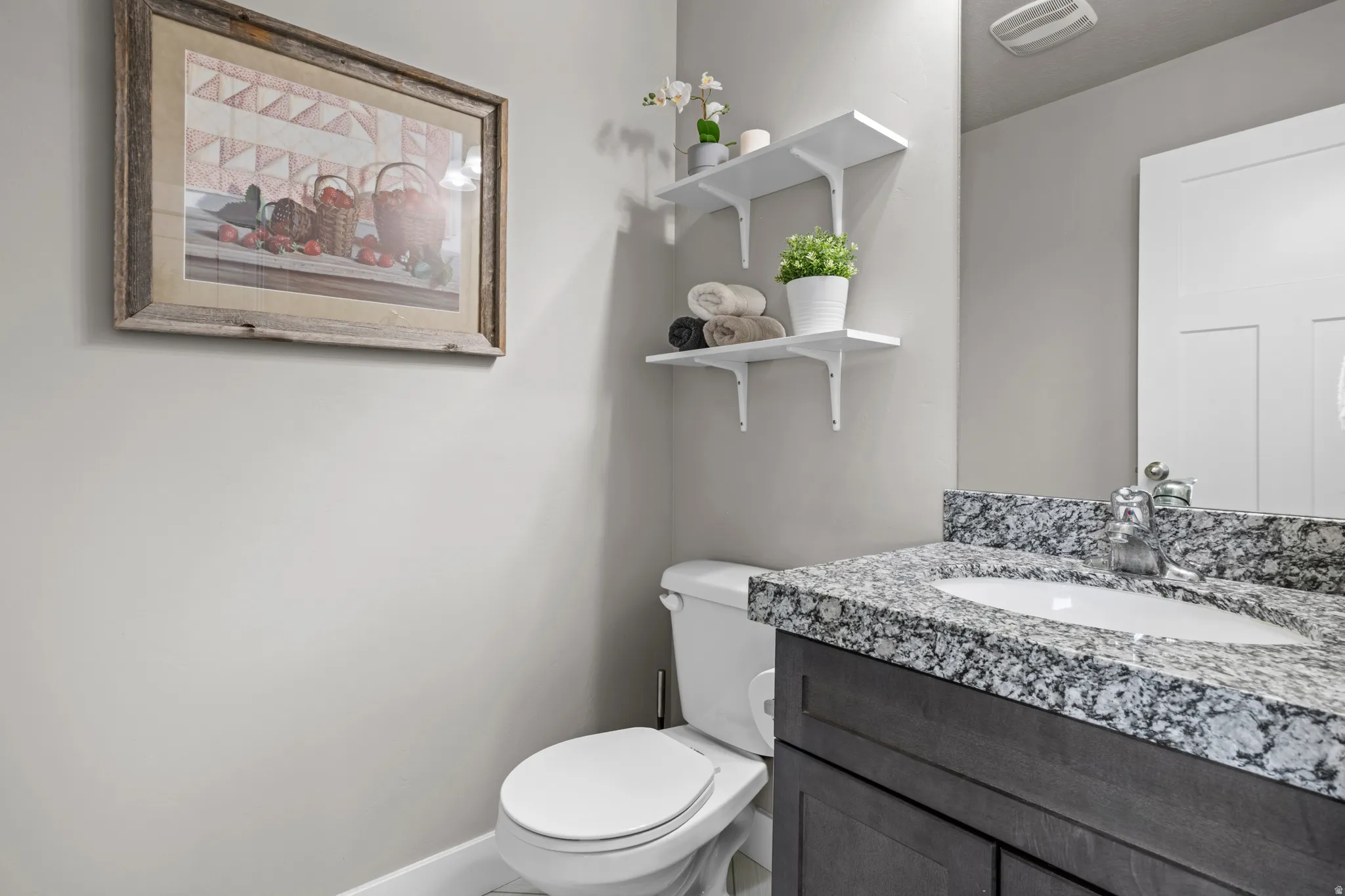 Half bath between kitchen and garage