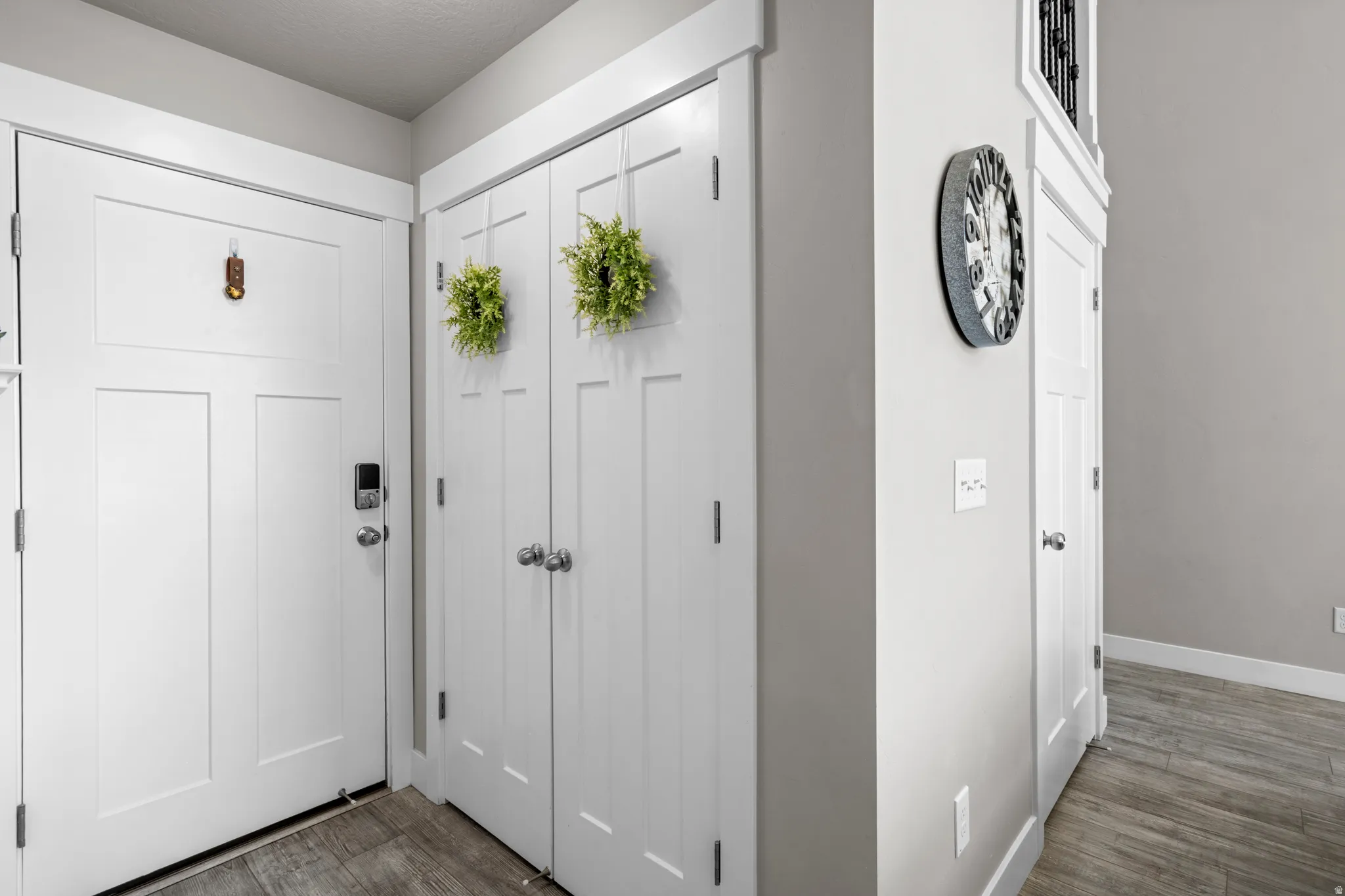 Garage door, closet, and door to basement