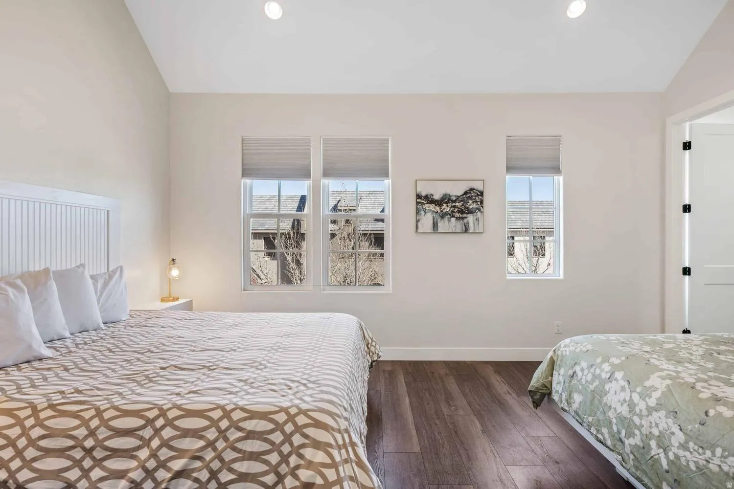 Vaulted ceilings complement the dark wood-finish flooring