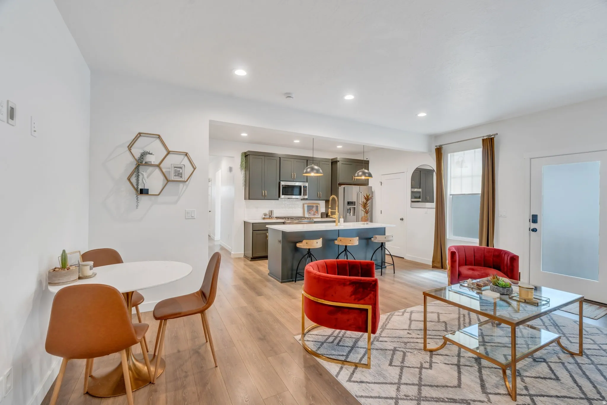 Open-concept living area featuring wood-finish flooring
