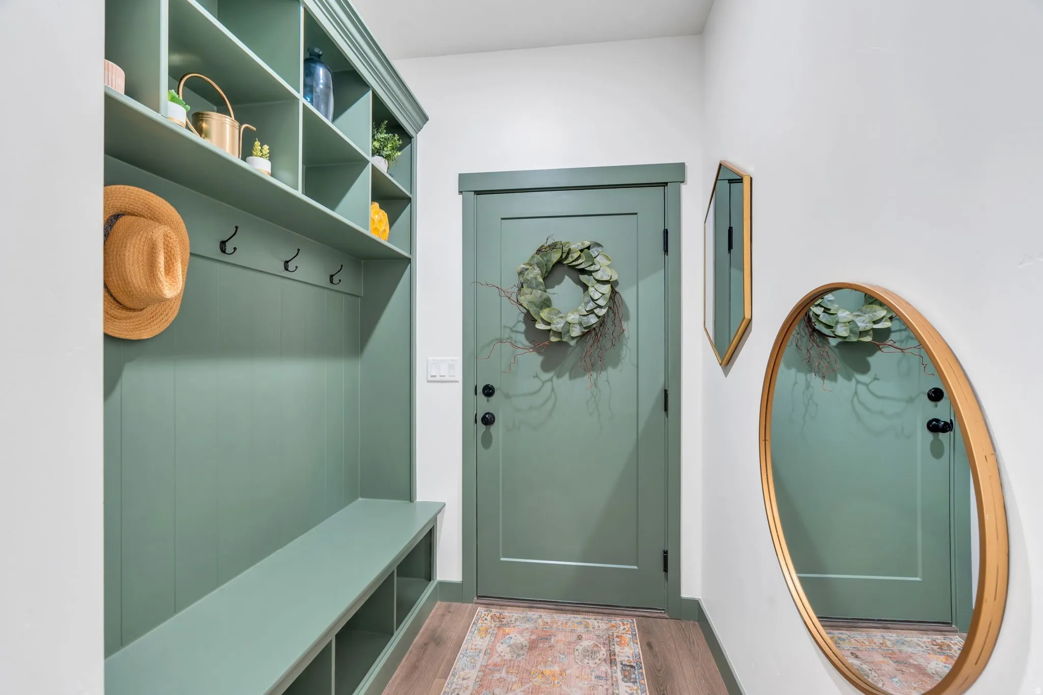 Built-in mudroom bench with cubby storage and upper shelving