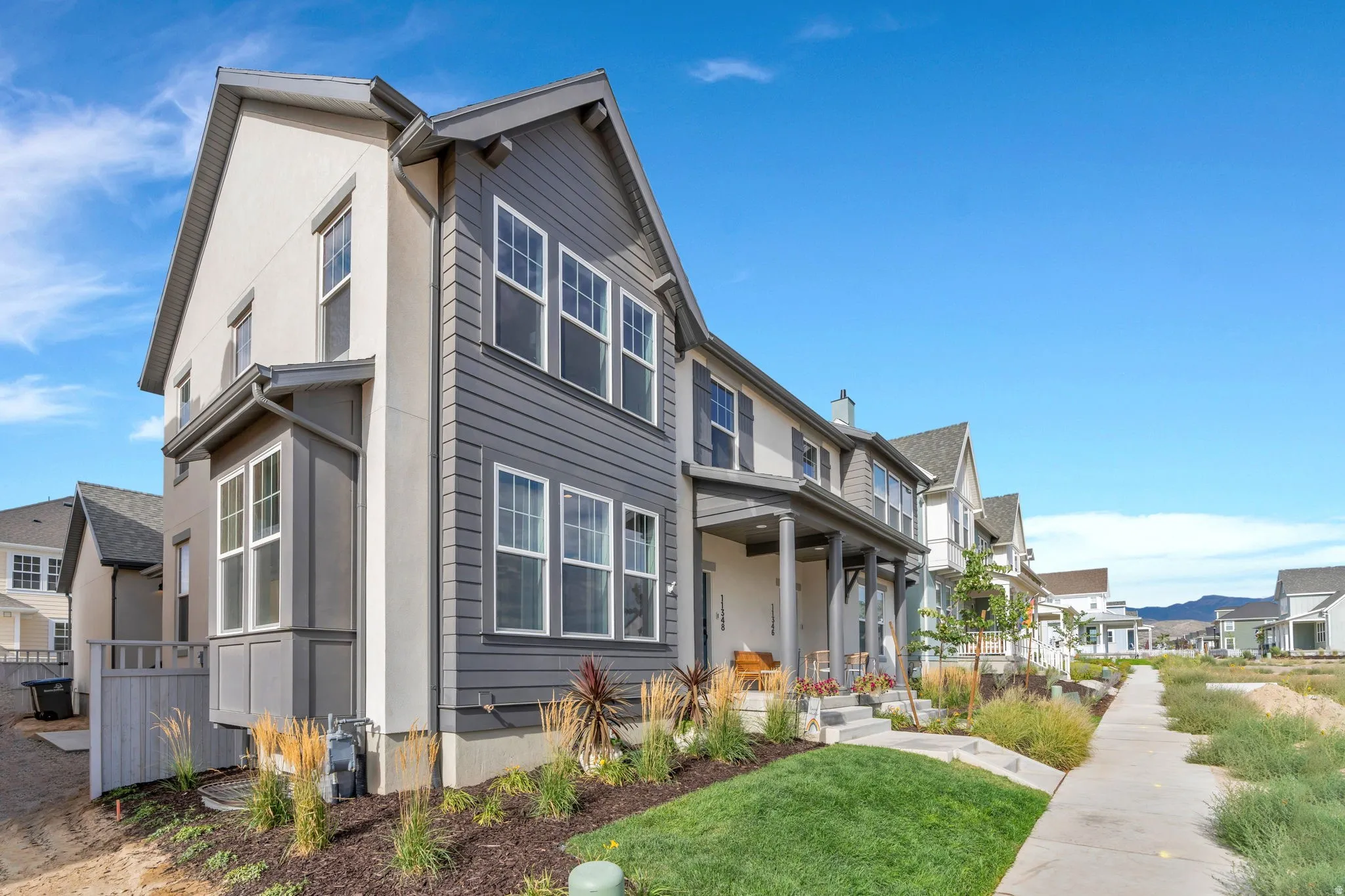 Multi-story residence featuring a combination of horizontal siding and stucco exterior finishes