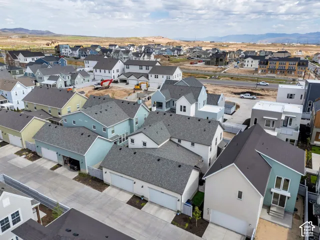 Residential development featuring a variety of single-family homes with pitched roofs and attached garages