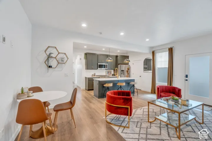 Open-concept living area featuring wood-finish flooring