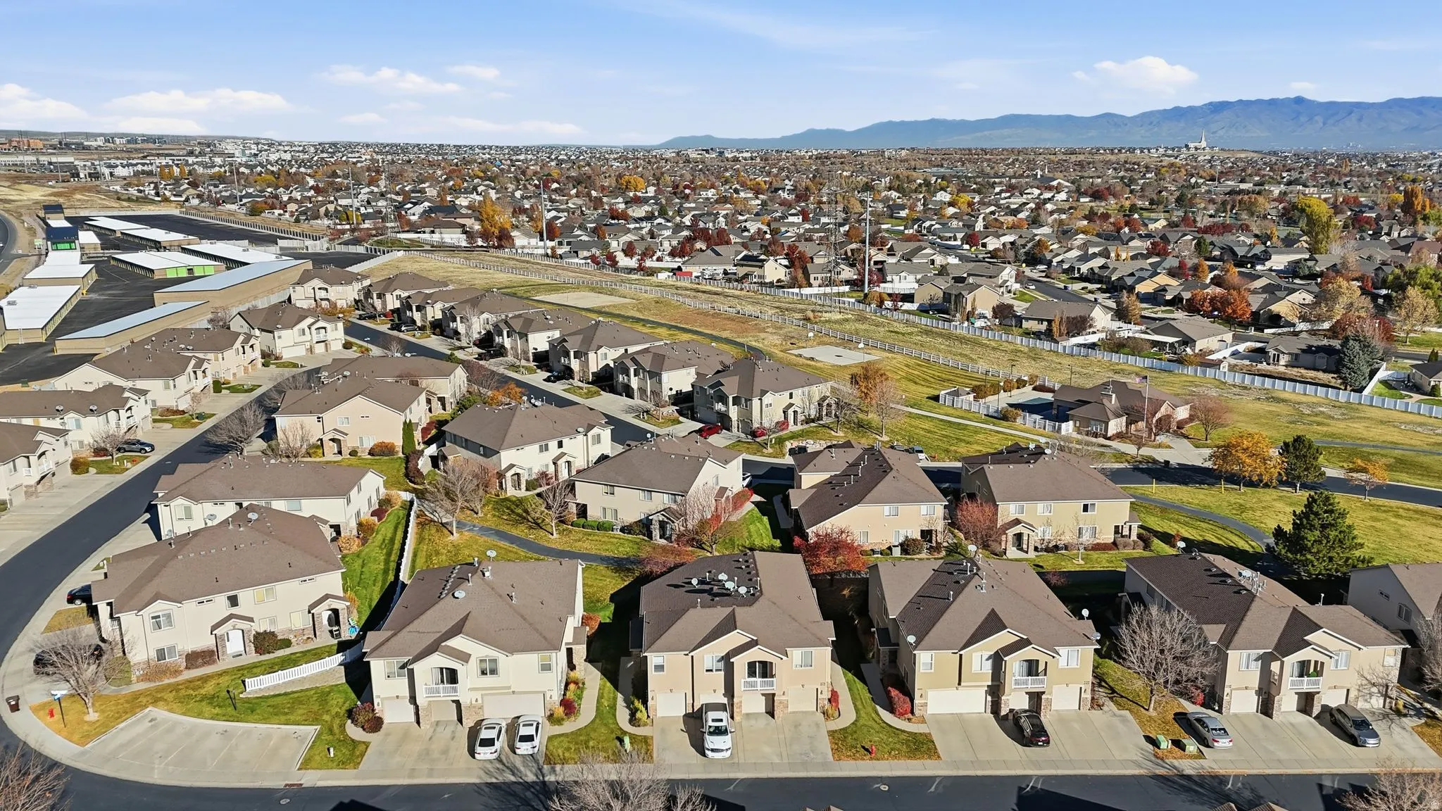 Expansive suburban landscape featuring numerous properties with multi-story facades and attached garages