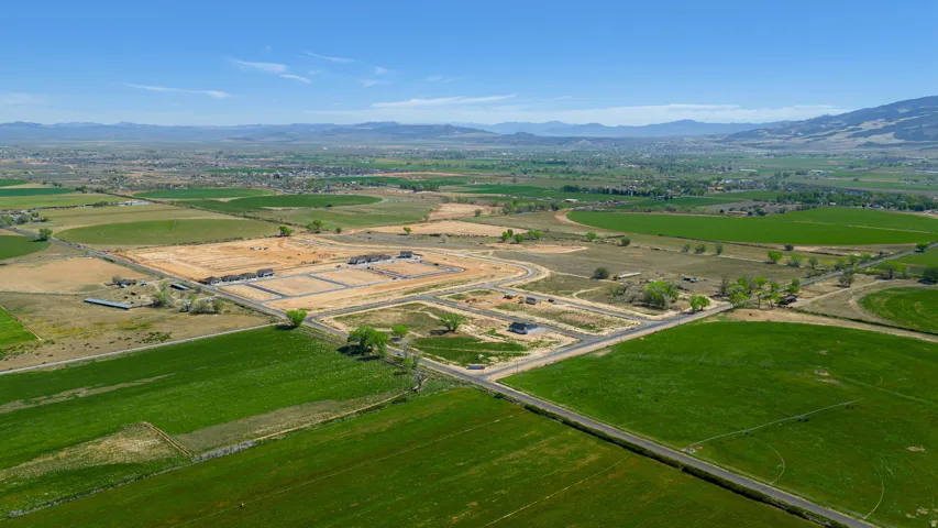Expansive rural landscape featuring a mix of green fields and developed land
