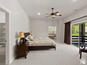 Spacious room featuring light-toned carpeting and recessed lighting