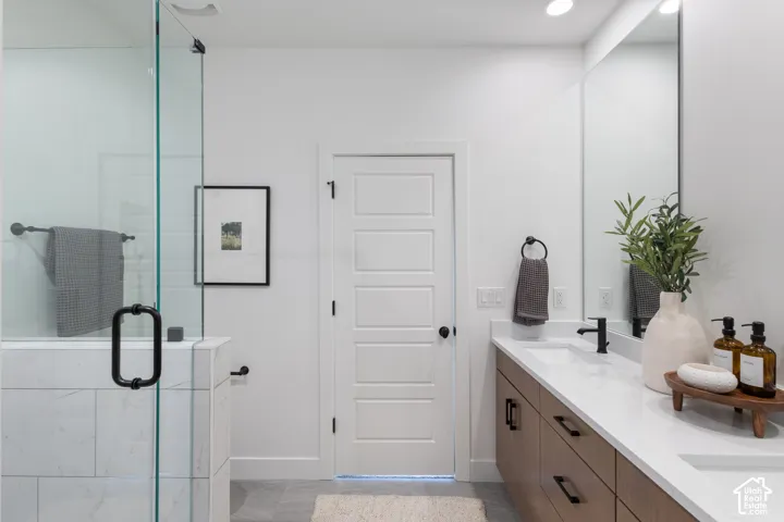 Photos of previous Model: Primary bathroom, featuring double vanity, and full euro shower