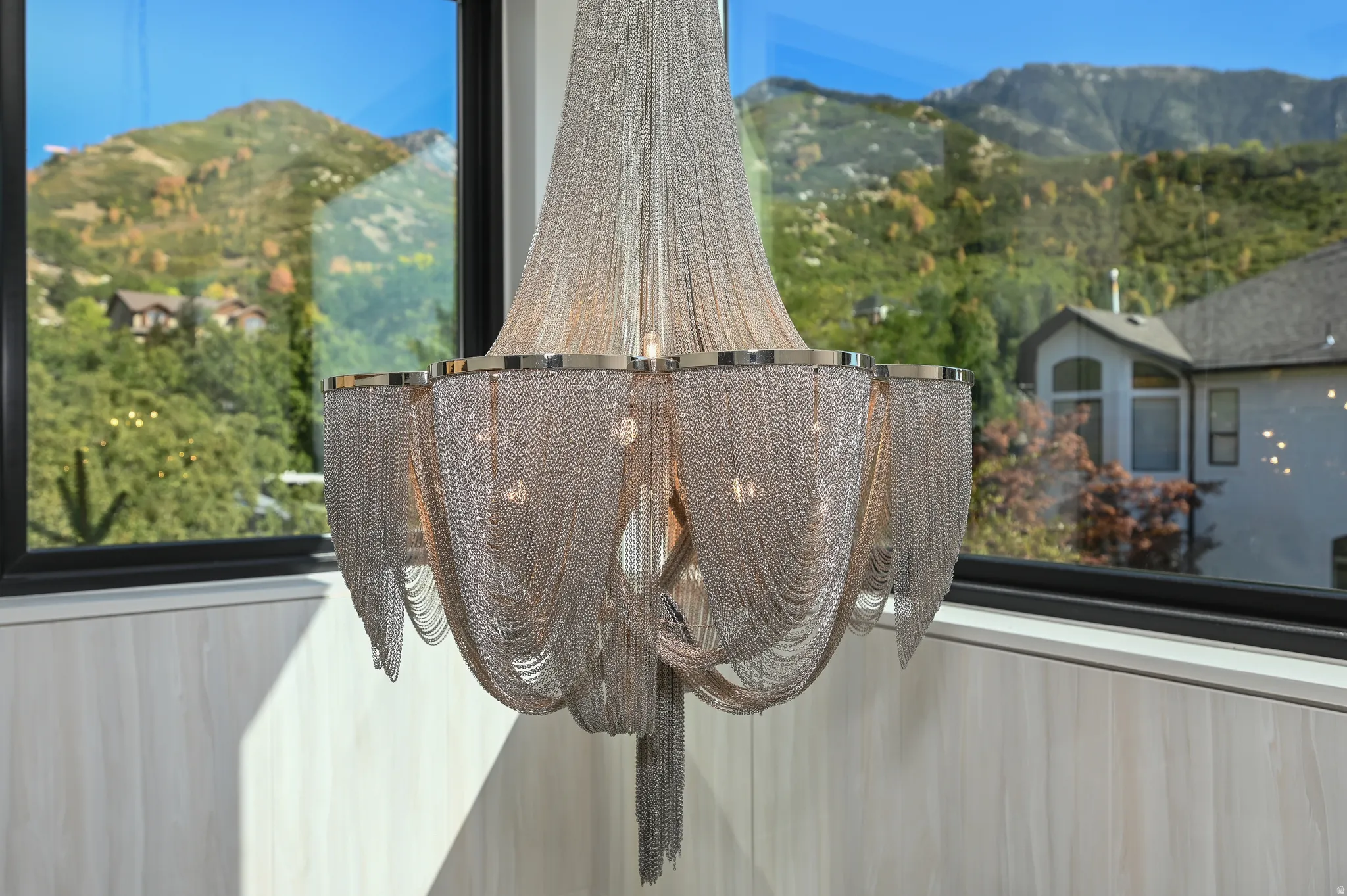 Contemporary chandelier with draped chain detailing