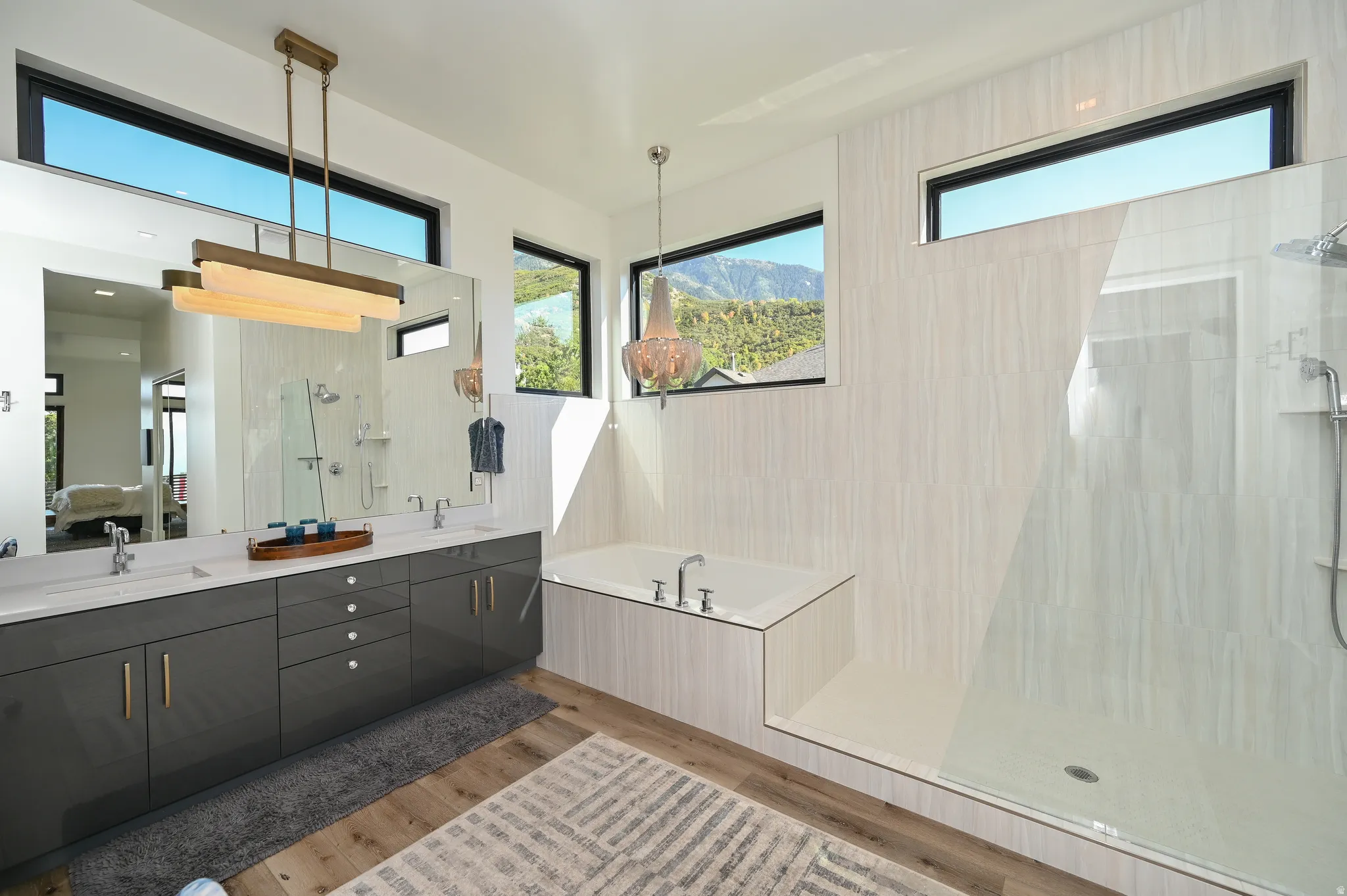 Contemporary bathroom featuring a large soaking tub and a spacious glass-enclosed shower
