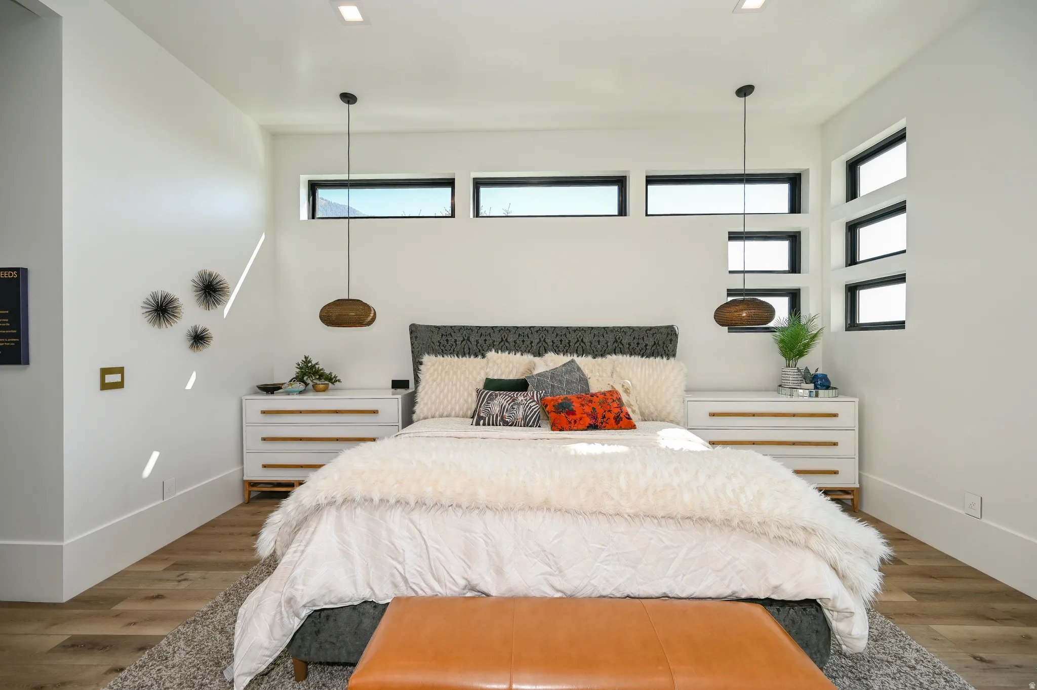 Spacious room featuring multiple transom windows and tall baseboards