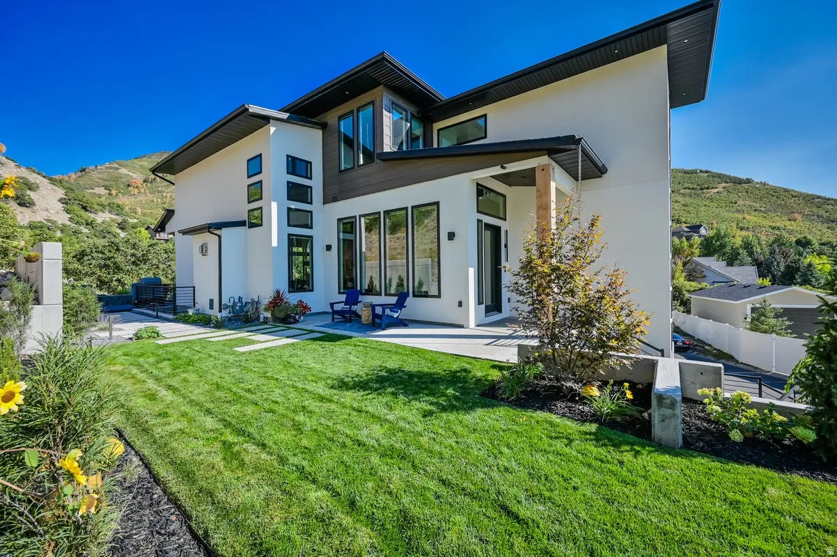 Contemporary exterior with white stucco and wood-finish siding