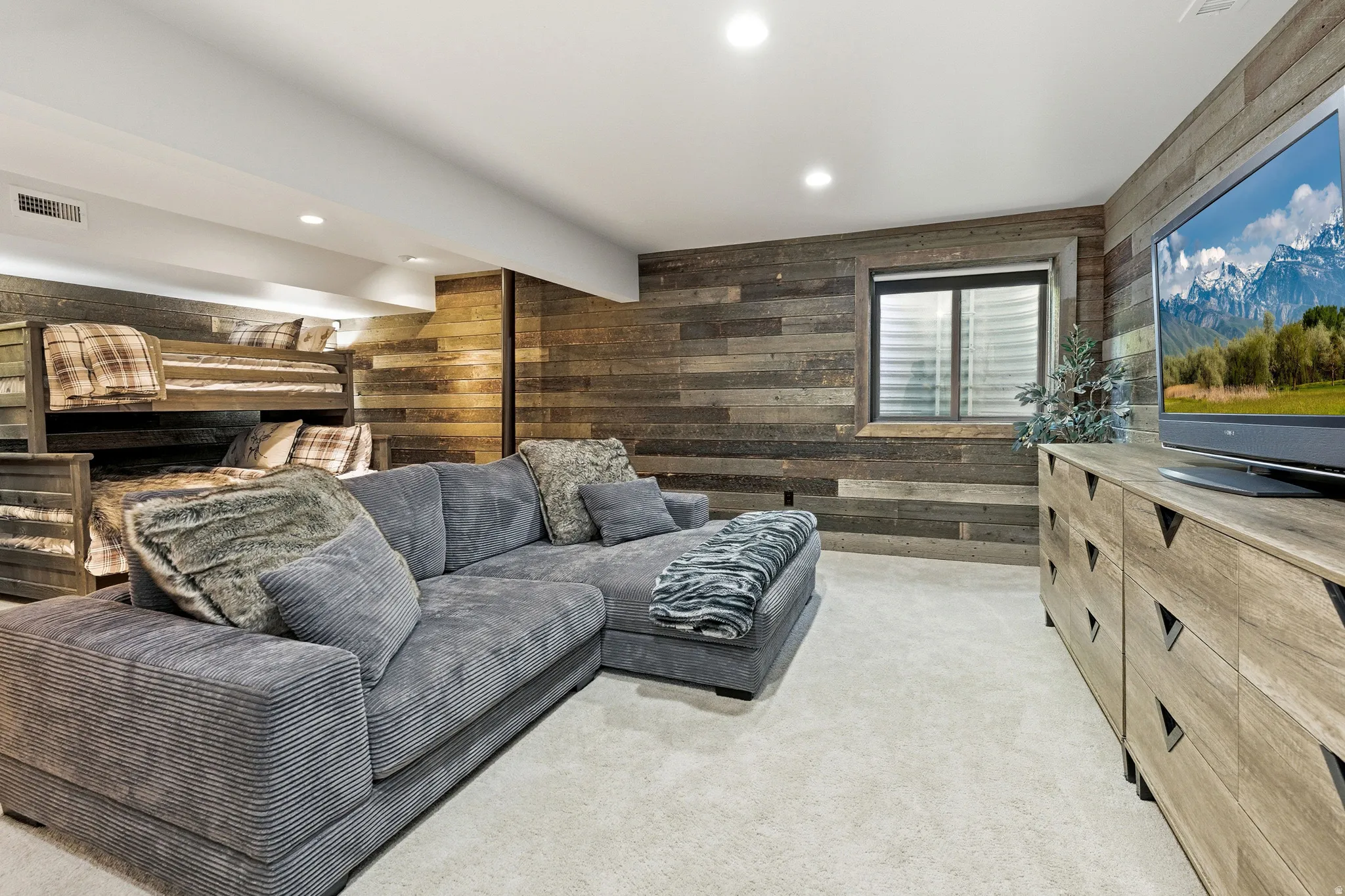 Reclaimed wood-finish wall paneling defines this living space