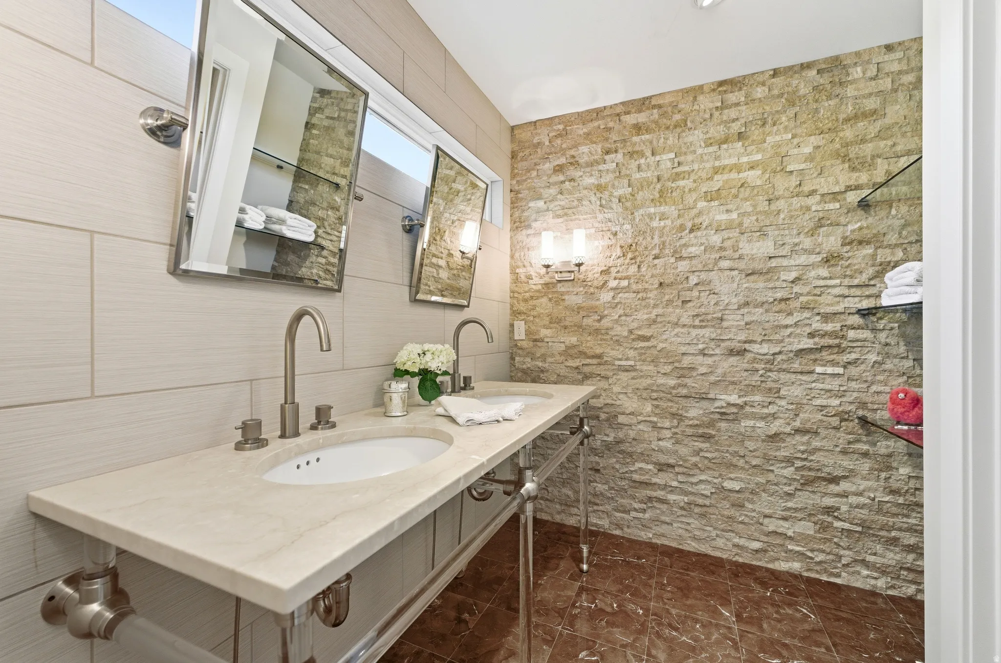 Dual vanity featuring a light-toned countertop with integrated sinks and brushed nickel fixtures